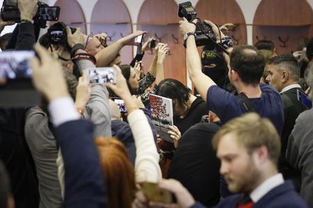 Alena Zsuzsová surrounded by journalists