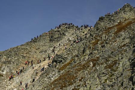Tourists walk to the top of Rysy (2,503 m) in the High Tatras on September 21, 2020.