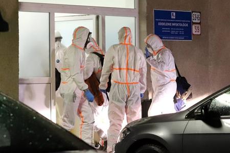 Medical staff admits two Slovak patients evacuated from the Chinese city of Wuhan to a Banská Bystrica hospital, central Slovakia, on February 3.
