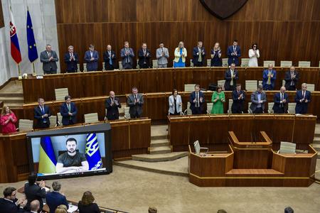 Slovak MPs are applauding Ukraine's President Volodymyr Zelensky after his address on May 10, 2022.