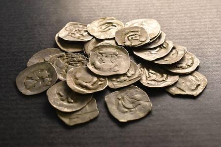Tourist finds ancient silver coins under an uprooted tree