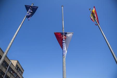Slovak flag symbolically lowered in protest in front of an administration office in Bratislava.
