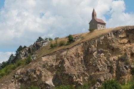 Romanesque church in jeopardy. Communists turned nearby terrain into a quarry