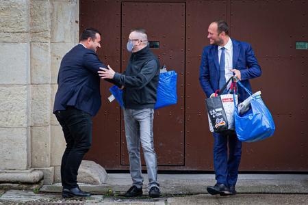 Vladimír Pčolinský (in the centre) leaves custody. 