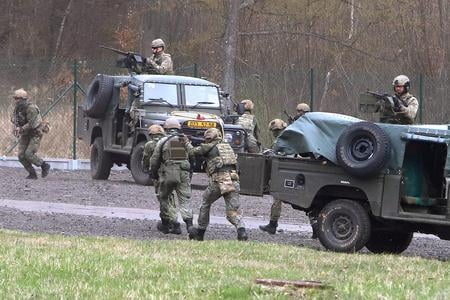 Slovak and NATO soldiers during a military exercise at the Lešť military training area on April 28, 2022.