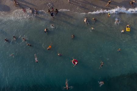 Holidaymakers enjoy the weather on a beach, in Dubrovnik, Croatia, Friday, Aug. 13, 2021.