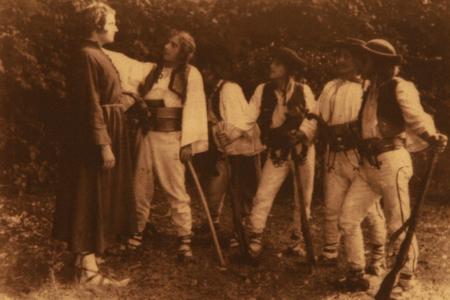 A photograph captures a scene from the "Jánošík" film, which is the first Slovak full-length feature film.