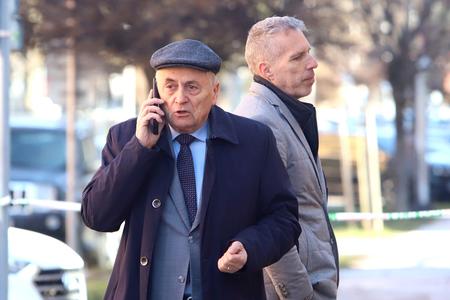 Ján Čarnogurský on the phone, Bohuš Garbár stands behind him.