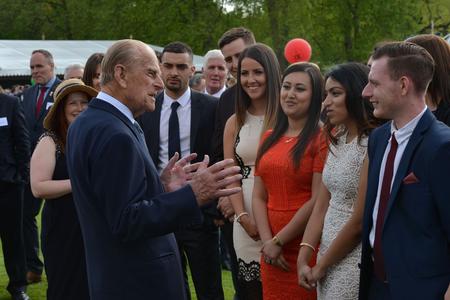 Prince Philip and young people who took part in the Duke of Edinburgh's Award talk at Buckingham Palace in 2012.
