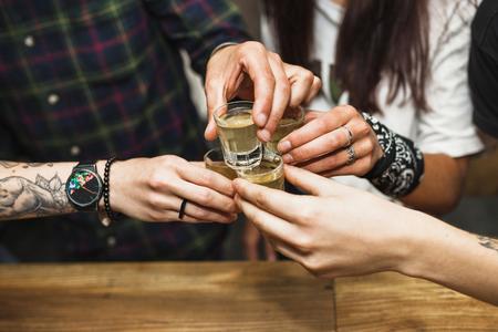 Friends drinking a kapurková shot.