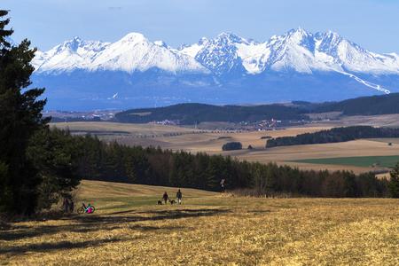 Tourists are on a trip to Tomášovský Výhľad in Slovak Paradise National Park on April 18, 2021. The Tatras are seen in the background.