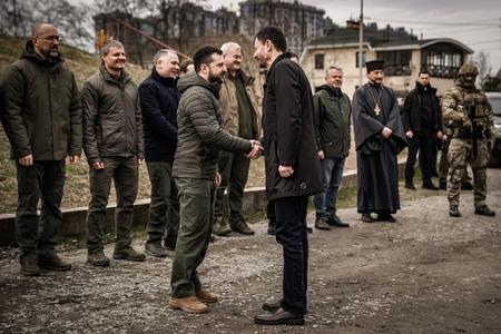 Ukrainian President Volodymyr Zelensky shakes his hand with Slovak PM Eduard Heger in Bucha, Ukraine, on March 31, 2023.