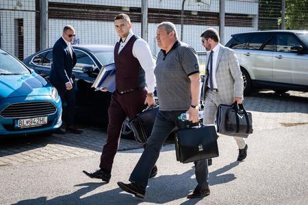 Ex-special prosecutor Dušan Kováčik (in grey shirt) with his lawyers on May 19, 2022.