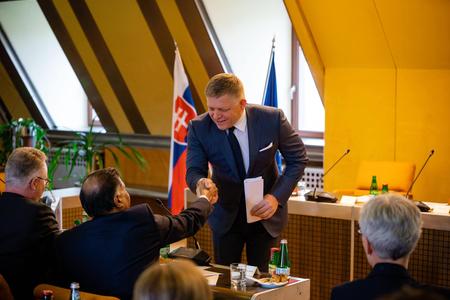 Smer leader Robert Fico shakes hands with US Ambassador to Slovakia Guatam Rana during a meeting on April 24, 2023.