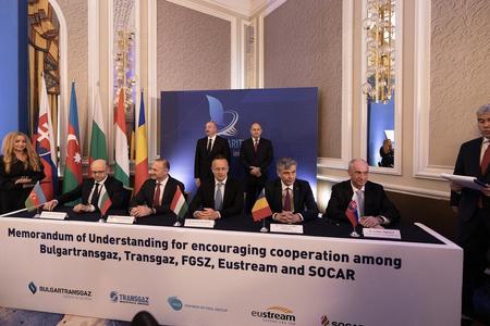 The signing ceremony, including Slovak Economy Minister Karel Hirman (seated on the far right).