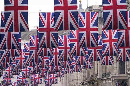Union flags hang over Regent Street ahead of the coronation of Britain's King Charles III, in London, on April 27, 2023. 