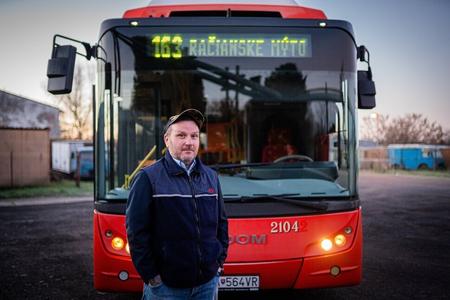 Roman Hulín poses in front of the bus number 163 he personally fought for.