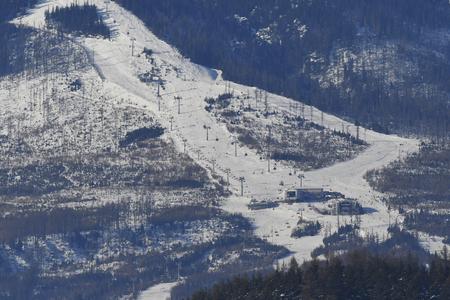 The middle part of the ski slopes of the ski resort in Tatranská Lomnica in the High Tatras.