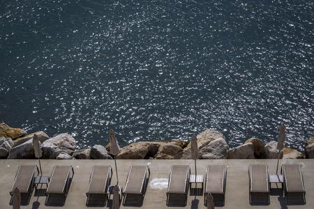 Beach loungers are set for tourists in Opatija, Croatia.