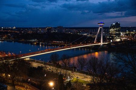 SNP Bridge in Bratislava at night.