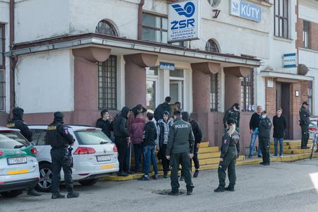 Police officers stand outside the Kúty train station on November 2, 2022.