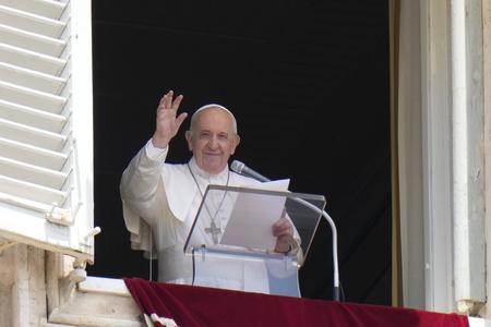 Pope Francis waves to the crowd as he arrives to recite the Angelus noon prayer from the window of his studio overlooking St Peter's Square, at the Vatican on July 4.