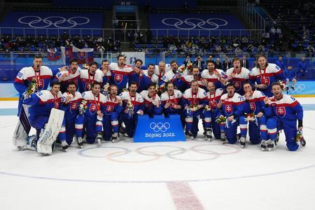 Slovakia poses for a photo after defeating Sweden in the men's bronze medal hockey game at the 2022 Winter Olympics.