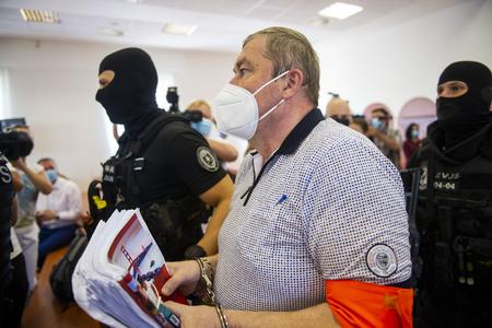 Dušan Kováčik escorted to the courtroom.