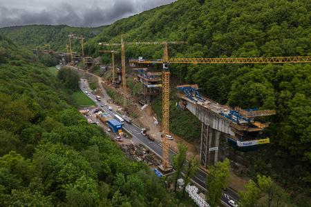 Cranes help build a motorway stretch in central Slovakia on June 7, 2023.