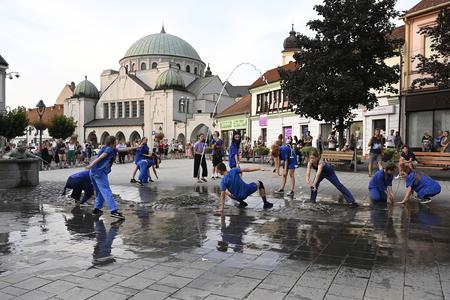 Dancers perform in the streets of Trenčín, spotlighting the architecture of the city.