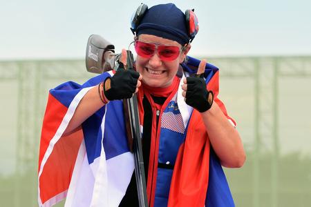 Zuzana Rehák Štefečeková celebrates her victory in the women's trap at the 2020 Summer Olympics in Tokyo.