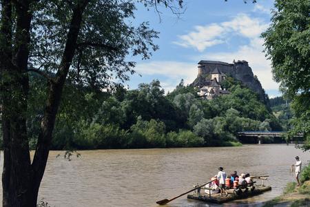 Tourists raft on the Orava river in the village of Oravský Podzámok, which is home to Orava Castle.