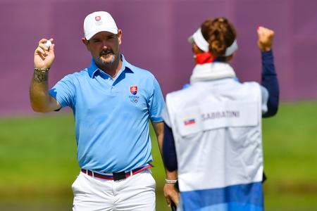 Rory Sabbatini and his caddy - his wife Martina - are happy after the last strike.