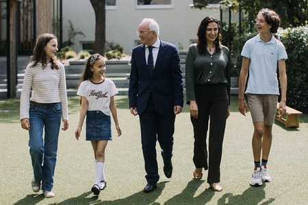 Aaron King in the grounds of the Cambridge International School in Bratislava with his family, wife Loredana, son Octavian and daughters Annabelle and Alexandra.