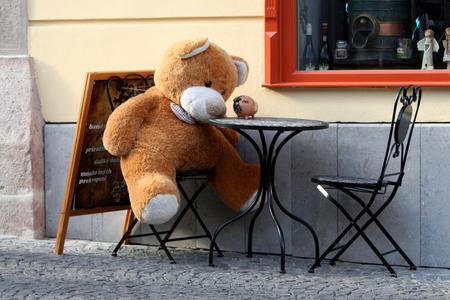 A teddy bear sits outside a cafe in Banská Štiavnica, central Slovakia, on September 12, 2017.