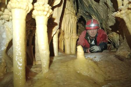 A caver poses in Pivnica Cave in the Liptov region.