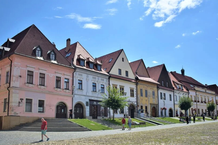 Several of the historic Burghers' houses. The pink one on the left is the one bough by Manevi SK, a Slovak daugher of Hungarian company Manevi.