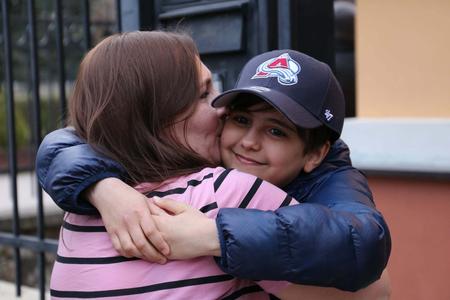 Yulia Pisetska hugs her son Hassan.