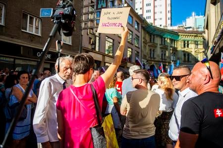 A protest against the new visual campaign of the P. O. Hviezdoslav Theatre was held on Wednesday. Several people showed to counterprotest as well. The person holds a sign that reads "Let's be tolerant towards each other. Stop attacking."