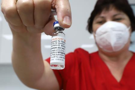 A nurse holds a Novavax vaccine during vaccination at a hospital in Banská Bystrica on March 10, 2022.