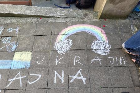 Ukraine-related drawings on a pavement.