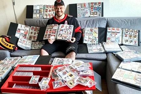 Andrej Plachý and his collection of cards.