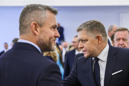 Hlas chair Peter Pellegrini (l) and Smer leader Robert Fico (r) meet in the historical parliamentary building on October 9, 2023 to receive a certificate confirming them as MPs.