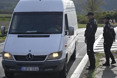Slovak police officers check a van at the Nové Mesto - Sátoraljaújhely border crossing on October 5, 2023.