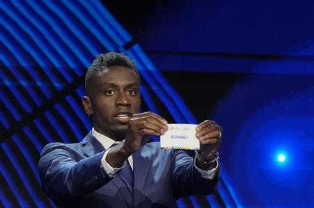 The former footballer Blaise Matuidi is showing a ticket with the name Slovakia during the draw for the final tournament of EURO 2024 in Hamburg on December 2, 2023.