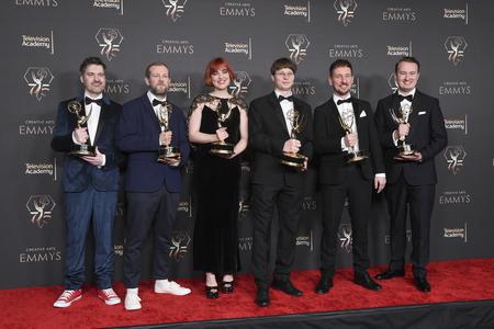 The team from "Ms. Marvel" pose with their awards for outstanding motion design during night one of the Creative Arts Emmy Awards. Slovak Dávid Štumpf is pictured third from the right.