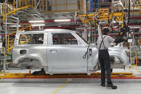 An employee operates the assembly line for the Land Rover Defender model at the Jaguar Land Rover manufacturing plant in Nitra on October 25, 2023.