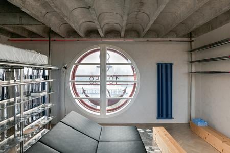 The designer and architect Alan Prekop turned a long unused tiny space into an unconventional living space.