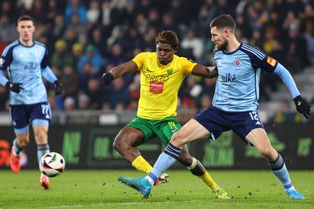 In the foreground, from left, battling for the ball are Eric Bile (Žilina) and Kenan Bajrič (Bratislava) during the 17th-round match of the Niké League between MŠK Žilina and ŠK Slovan Bratislava on December 7, 2024, in Žilina.