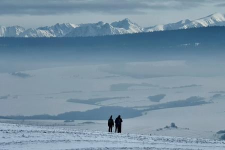 A breathtaking view of the snow-draped Tatra Mountains as seen from the town of Trstená.